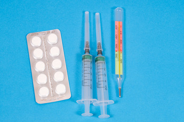 medical items, thermometer, syringes, medical mask, pills
