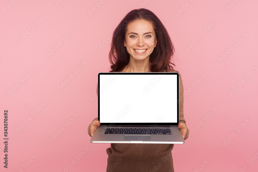 Wall mural portrait of beautiful woman holding laptop with white screen copy space, mock up display for interne