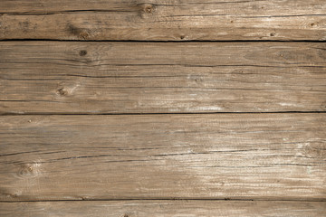 Fototapeta na wymiar Old weathered wood surface. wooden background texture of wall of log rural house with copy space for your design. Blank template