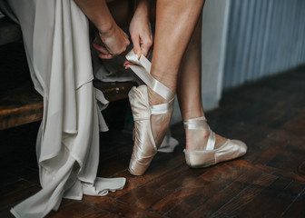 Special footwear. Close up of a pointe shoe on the foot of a nice professional ballet dancer.