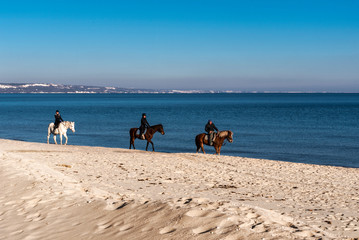 Horse riding on the beach.