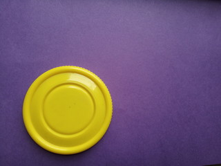 yellow plastic on plane surface