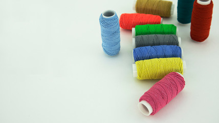 set of embroidery threads on a white background