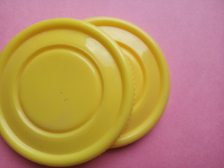 yellow plastics on plane surface