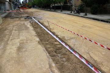 Maintenance and repair of underground pipe system, repair of plastic tube water delivery system, installation of underground water line - Athens, Greece, April 23 2020.