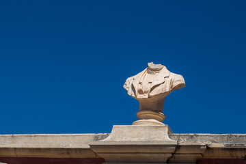 Bust without a head and blue sky