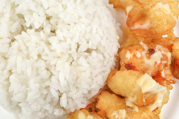 Butter Chicken Rice deep fried boneless chicken cube topped with sweet butter sauce with white rice cucumber and tomato slice