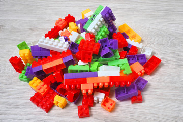 Plastic toy building blocks. Educational game for children. Children's room.