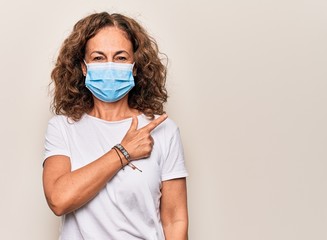Middle age woman wearing coronavirus protection mask for covid-19 epidemic virus smiling cheerful...
