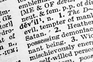 Devil - Closeup macro of English dictionary page with word devil concept