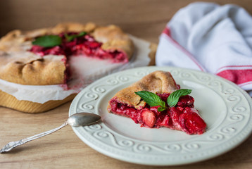 slice of strawberry pie with nuts and mint