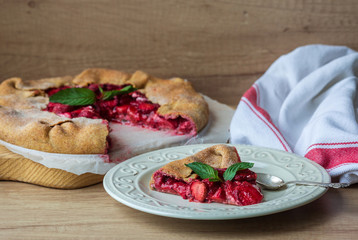 slice of strawberry pie with nuts and mint