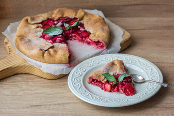slice of strawberry pie with nuts and mint