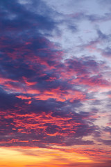 Colorful sunset sky and clouds, vertical photo