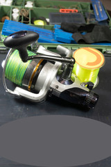 Fishing equipment on a old wooden table. Sport and recreation concept