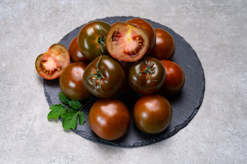 Fresh ripe sweet reddish brown and green kumato tomatoes