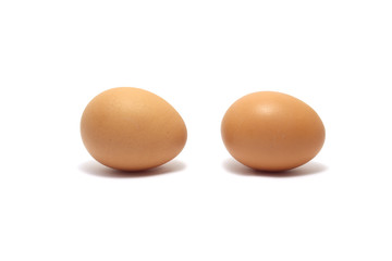 Two chicken eggs isolated on white background