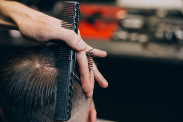 straight razor, brush for shaving beard along with bowl, blurred background of hair salon for men, barber shop