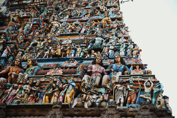 Relief sculptures and statues on hindu temple in Chennai, India. Bas-relief art.
