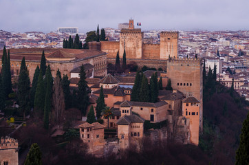 Fototapeta premium View of the Alhambra and the Generalife and the city of Granada from the viewpoint of the Silla del Moro at sunrise.