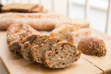 fresh loaf of bread on wooden board