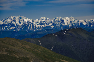 Spectacular view from the top of the mountain to the mountain range in the Ulagansky District of the Altai republic, Russia