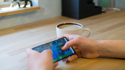 close up of hands typing on a smartphone