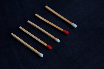 1 Red matchstick outstanding form kindle matchstick in isolated background.