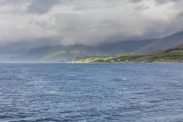 End of fjord. Beautiful Norwegian landscape. view of the fjords. Norway ideal fjord reflection in clear water In cloudy weather. selective focus