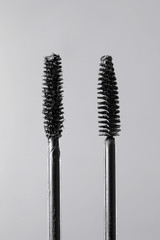 Close-up of a mascara brush with a white background