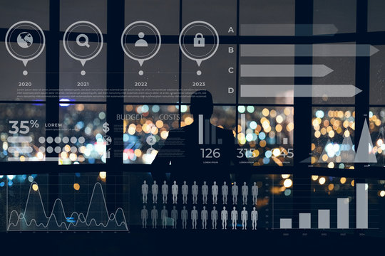 Businessman looks out the window at night city. Collage with graphs