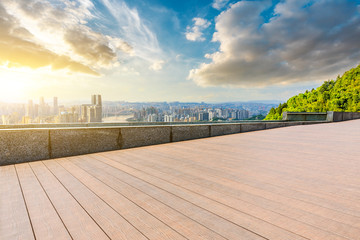 Empty square floor and chongqing city skyline at sunset,China.