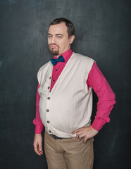 Funny offended teacher or business man on blackboard