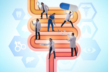 Doctors treating intestines illness - medical illustration