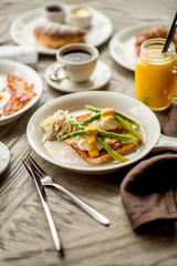 Breakfast with coffee toast with egg juice daylight cafe restaurant towel american wooden table