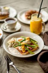 Breakfast with coffee toast with egg juice daylight cafe restaurant towel american wooden table