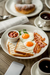 Obraz na płótnie Canvas Breakfast with coffee toast with egg juice daylight cafe restaurant towel american wooden table