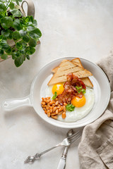 Breakfast with ham egg beans toast daylight cafe restaurant towel american wooden table on stone
