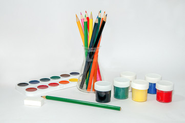 Colored pencils, paints, gouache, watercolors on a white background