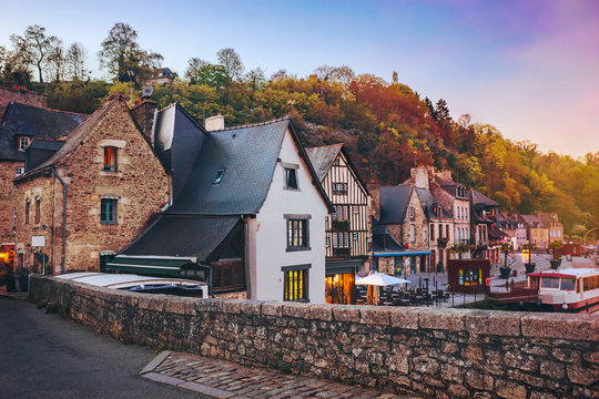 The picturesque medieval port of Dinan on the Rance Estuary, Brittany,France.The medieval city of Dinan in the setting sun, a popular tourist spot in France