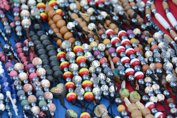 colourful beads of glass and shells, for sale