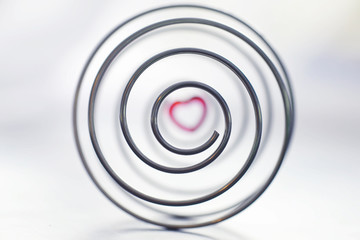 Metal spiral. The concept of endless turns. Golden ratio. The concept of memories and life path.