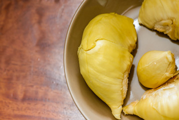 The close-up of the yellow durian on the plate looks appetizing. This is a fruit that is famous in Thailand and is called the king of fruits.