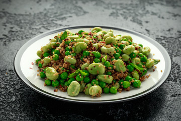 Vegan Green broad beans and quinoa salad with sweet peas and mint. Healthy food.