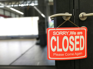 Sorry we're closed door sign board on the door, closed shut down cafe, restaurant, gym and other business due to coronavirus or COVID-19 global pandemic crisis, self quarantine and lockdown city
