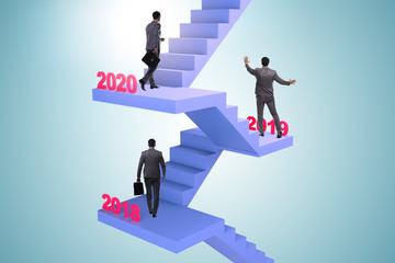Businessman climbing stairs on yearly basis