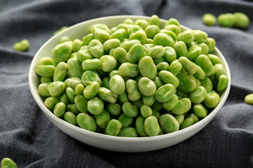 Green Broad Beans in a white bowl. healthy food