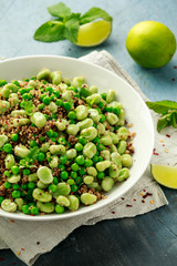 Green Broad beans and quinoa salad with sweet peas and mint. Healthy vegan food