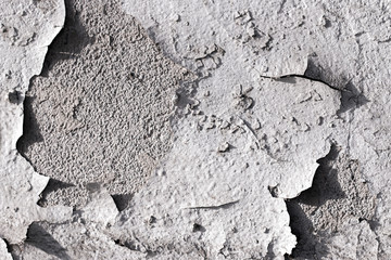 Old wall fragment. Old wall part with damaged plaster and paint.