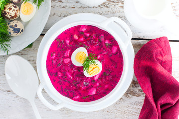 Traditional cold summer beetroot soup with vegetables, top view, selective focus